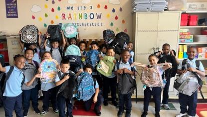All student at school 15 receive backpacks and school supplies