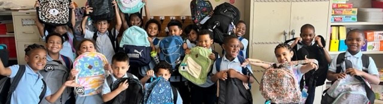 All student at school 15 receive backpacks and school supplies