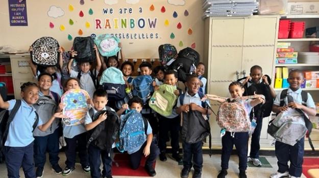 All student at school 15 receive backpacks and school supplies